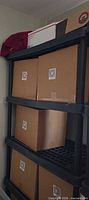 Full view of shelving unit loaded with boxes