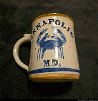 Mug side showing blue crab motif and Annapolis MD text