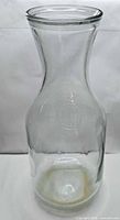 Full view of clear Mason embossed glass carafe