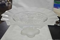 Overall view of dish showing ruffled rim and foot