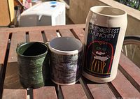 Group shot of stein, floral mug, green tankard