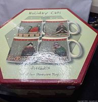 Box showing artwork and branding for set of four stoneware mugs