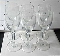 Six crystal cordial glasses front view showing stems and bowls
