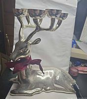 side profile showing reindeer form and candle cups