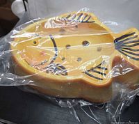 Side view in plastic wrapping highlighting profile and paint details