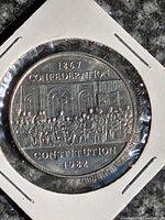 Reverse of 1982 Canadian Constitution commemorative dollar coin showing "1867 Confederation Constitution 1982" design