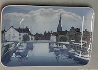 Front view of plaque showing full harbor scene