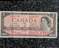 Obverse of 1954 $2 note showing portrait, serial number and signatures