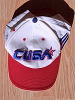 Top view of white, red and navy embroidered Cuba baseball cap