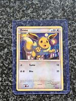 Front view of Eevee Pokémon card in sleeve