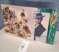 Front covers of Reg Strikes Back and Jump Up! albums