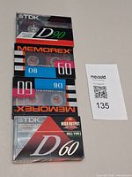 Front view showing all four sealed tapes stacked