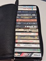 Full view of cassette carry case open showing all tapes