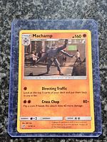 Front of Machamp holo promo card in protective case