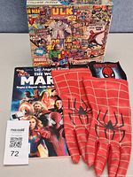 Full lot view showing puzzle box, magazine, gloves, patch