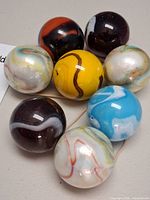 Eight multicolor swirl marbles grouped together