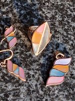 front view of ring, pendant and earrings showing multicolour inlay