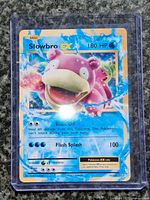 Front view of Slowbro EX holographic card in protective case