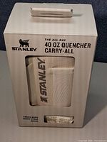 Front of retail box showing Stanley Quencher Carry-All Companion Sling