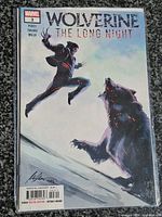 Front cover showing title, issue number, artwork, and signature