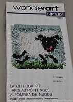 Front view of sealed WonderArt Shaggy Sheep latch hook kit packaging