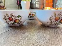Three Alfred Meakin Hereford bowls showing exterior fruit motif