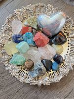 Top view of tray with assorted stones and metal heart