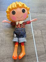 Full view of doll showing size, outfit, boots