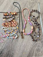 All necklaces and bracelets laid out showing variety