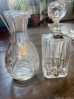 Fifth Avenue Crystal vase and Atlantis decanter side by side