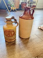 Both stoneware pieces standing side by side