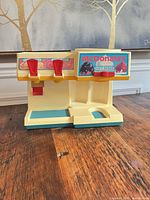 Front view showing McDonald’s graphics, dual levers, base pads