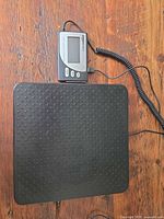 Top view of black textured weighing platform with attached LCD module