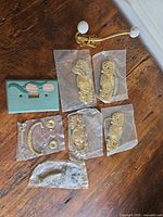 All items grouped: backplates, bail handles, coat hook, switch plate, screws