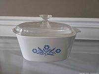 Side view showing cornflower motif, dish shape and lid