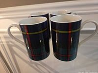 Four Dunoon MacLeod Tartan mugs front view