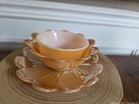 Three pieces stacked: saucer, medium ruffled bowl, small bowl