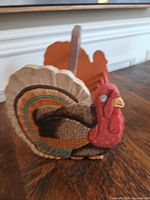 Front angled view showing carved turkey detail and paint colors