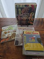 All four books front covers displayed