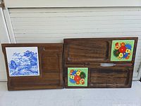 Both wood boards side by side showing ceramic tile designs and knife