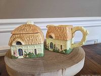 Front view of cottage sugar bowl with lid and matching creamer