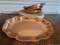 Tray front with two stacked pans showing materials and design