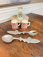 Full lot showing Portofino shaker, two mug shakers, fish spoon and fork