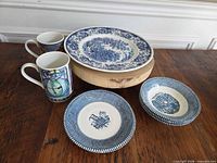 Entire lot showing dinner plate, side plates, bowls and mugs
