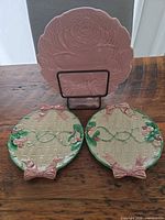 Front view of all three plates showing designs and colors