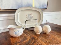 Full set showing platter, creamer, shakers