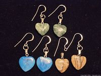 Overview of three pairs of heart earrings with hooks