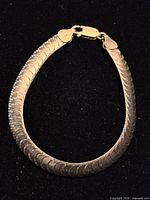 Full view of sterling silver bracelet laid flat