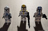 Front view of three Clone Trooper minifigures with blasters