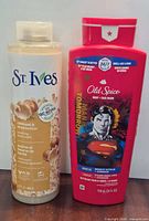 Front view of both body wash bottles showing labels, graphics and volumes